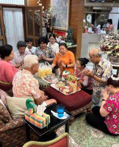 Family celebrating Songkran at home