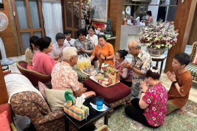 Family celebrating Songkran at home