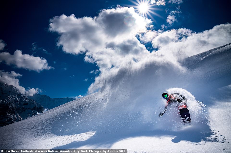 This high-octane picture shows the Swiss snowboarder Gian Simmen 'in his natural habitat' on Switzerland's Grindelwald First. Photographer Tinu Muller, who took the gold medal in the national award for Switzerland, says it was a 'perfect day in the Swiss Alps' when he clicked the shutter on this shot.