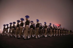 Soldiers take part in the rehearsal for the Republic Day parade on a foggy winter morning in New Delhi.